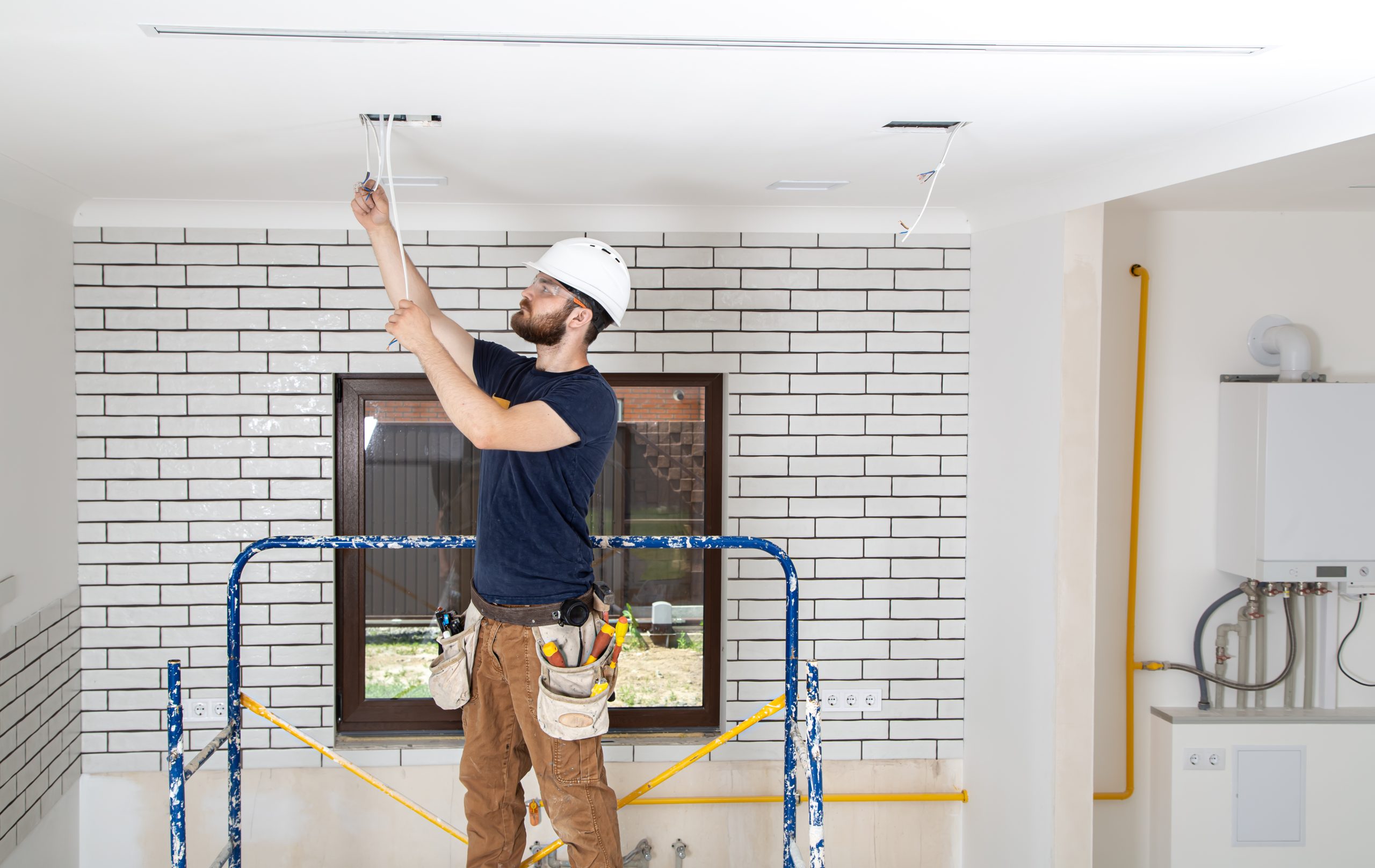 professional overalls with tools background repair site home renovation concept scaled-hayward-california